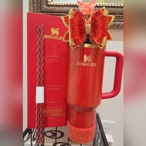 Stanley Scarlet Tinsel Travel Tumbler with Handle, Bow, and Boot.